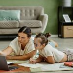 girl-studying-with-mom-on-floor